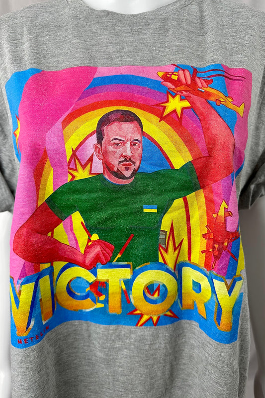 Photograph of shirt designed by Denys Metelin, which features a drawing of President Zelenskyy of Ukraine with the caption "VICTORY."